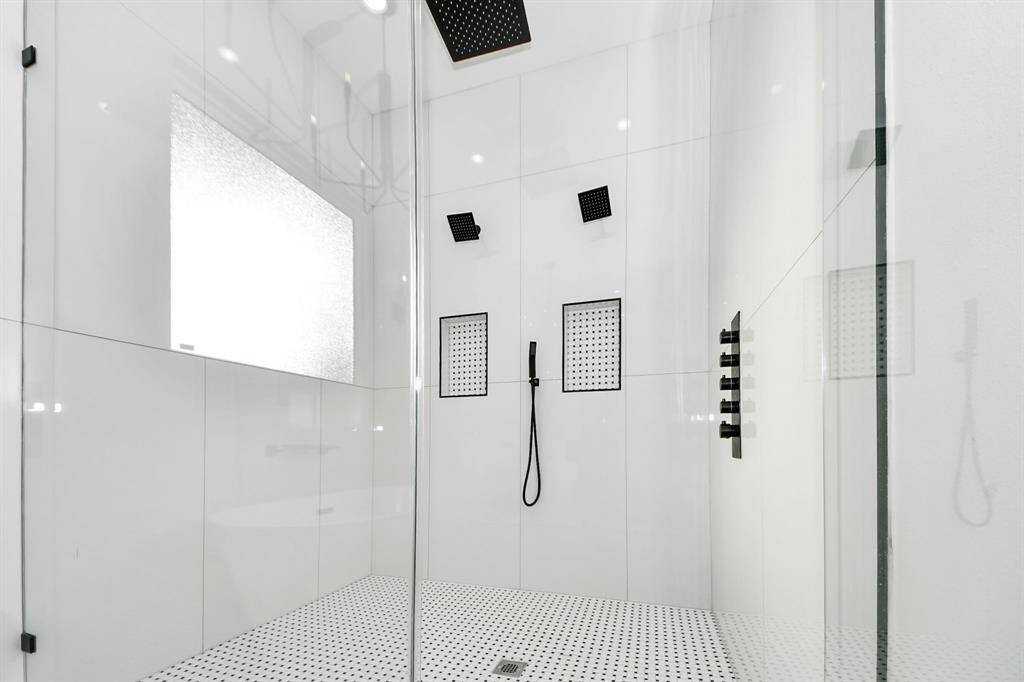 Your showering options are plentiful, with a rainfall showerhead, two additional shower heads, and a handheld for ultimate flexibility and a customized experience.