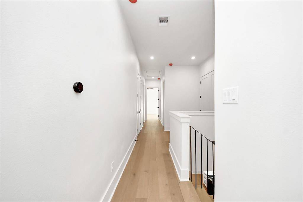 Notice the Nest dual zoning system to the right, providing customizable climate control. The primary suite is thoughtfully located on the opposite side of the home from the remaining bedrooms, offering added privacy and tranquility.