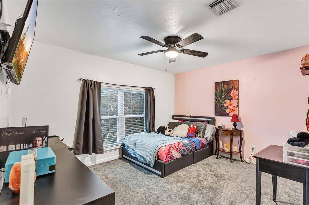 Secondary bedroom with large closet space.