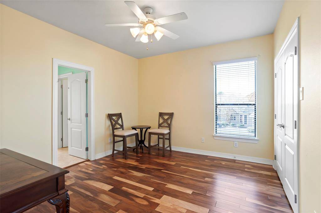 This bedrrom features warm, wooden brazilian flooring and neutral walls, creating a cozy atmosphere. It has a jack and jill bathroom with the 3rd bedroom upstairs.