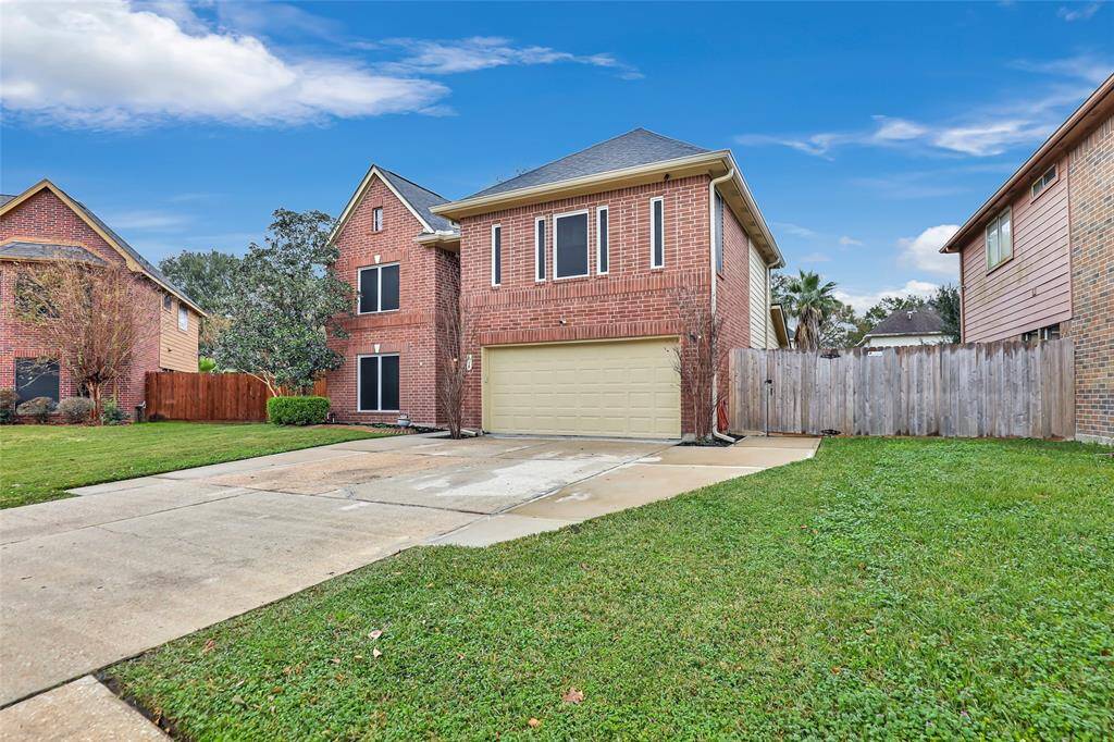 2 car garage with tons of parking space.