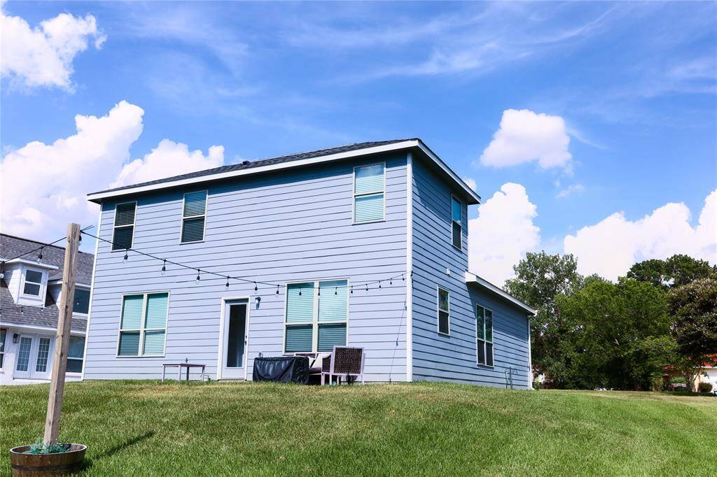 Back of house with patio