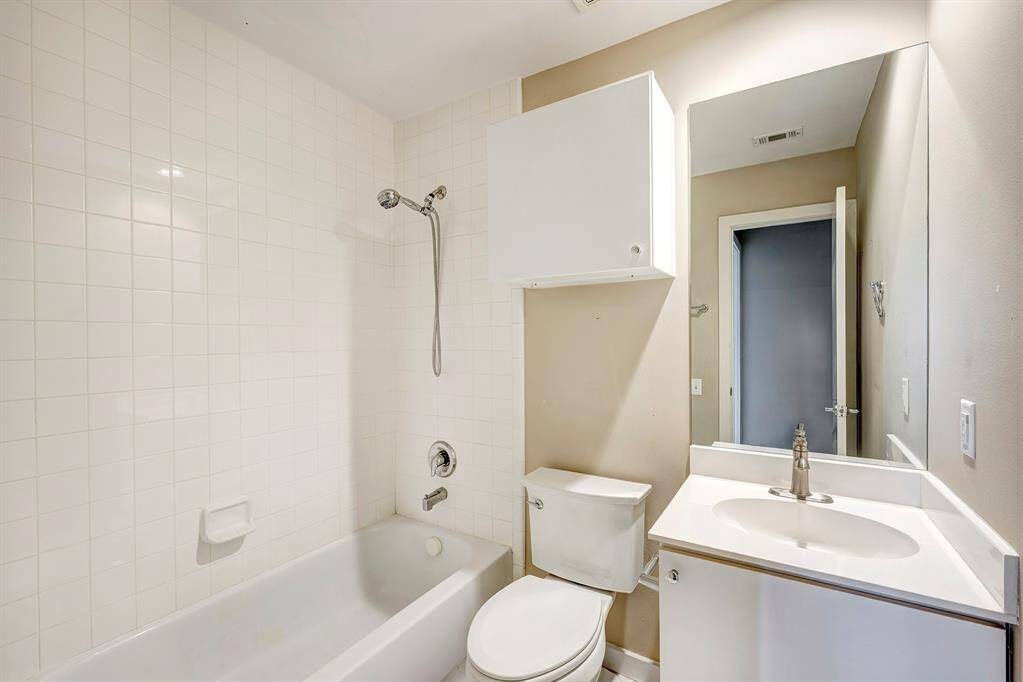 First floor bath boasts of cultures marble vanity ,tile flooring and a full bath with tub and shower.