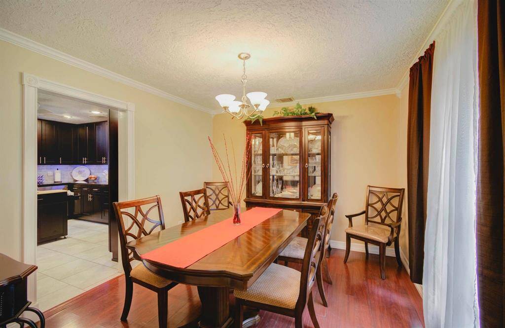 Formal dining to the right of entry looking into kitchen