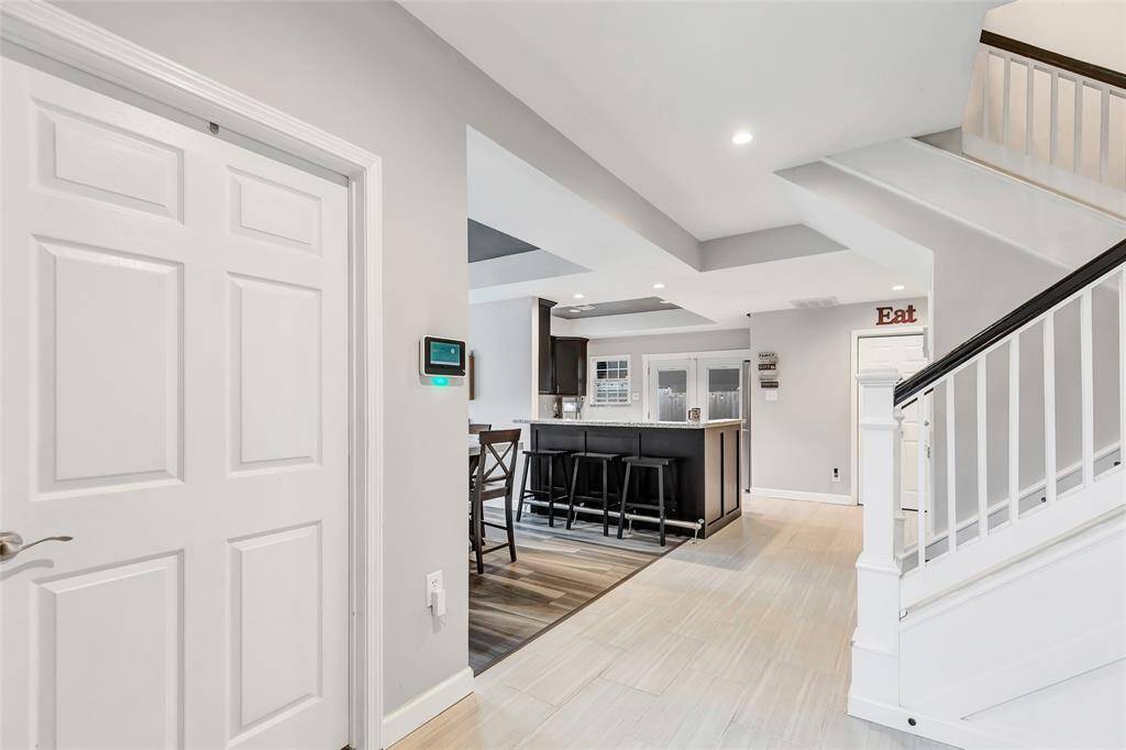 Office to the left and ahead is the formal dining kitchen and living room.