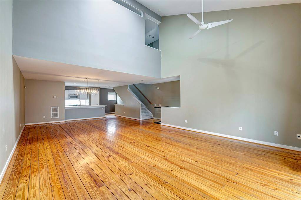 The open floor plan combines the living and dining areas with access to the breafast bar and kitchen.