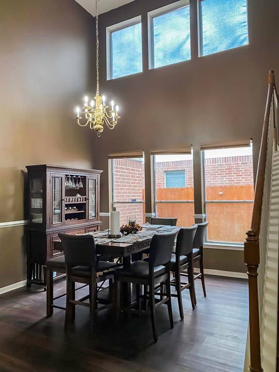 Beautiful open formal dining room with vaulted ceilings.