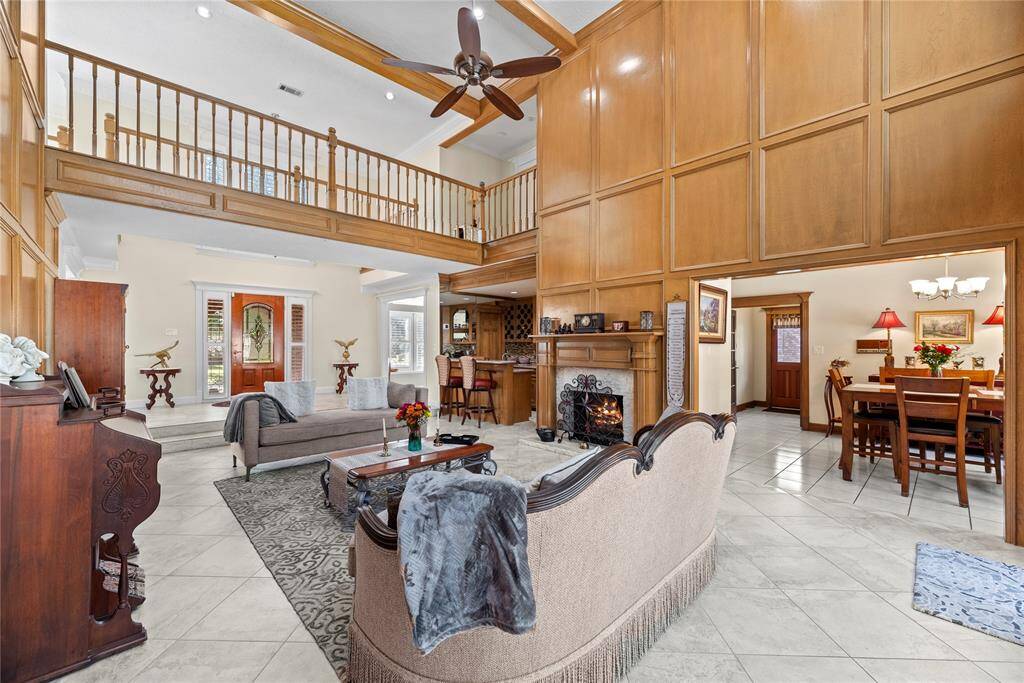 With its enchanting combination of comfort and charm, this room is a true haven for cherished moments and lasting memories. The stunning fireplace serves as a captivating focal point, radiating warmth and creating an inviting atmosphere for everyone.