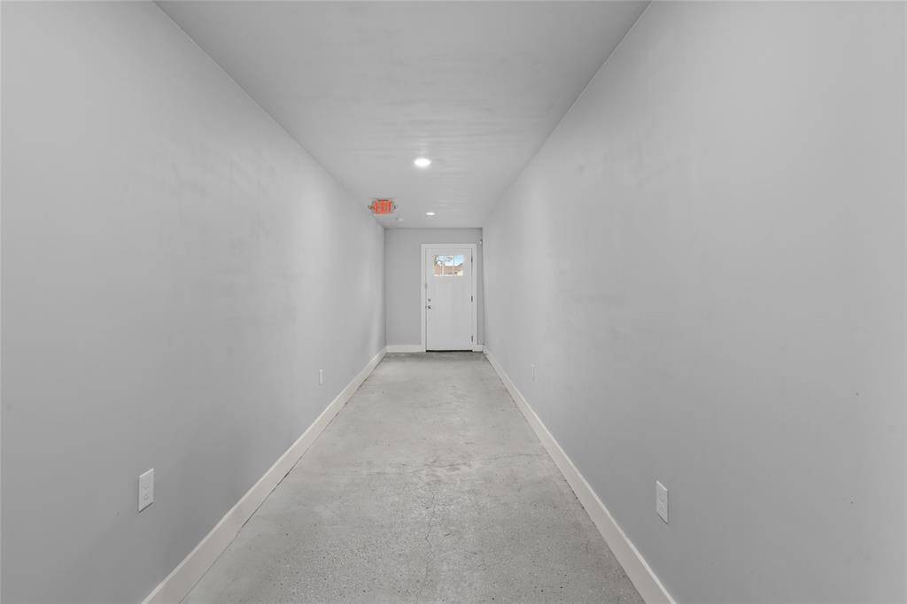 This is the Private entrance hallway from the front of the building to the Living Quarters in the back