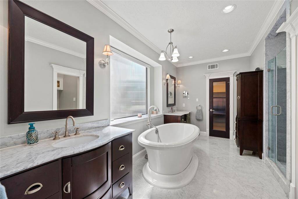Dual vanities offer personal space with tons of dedicated cabinet space.