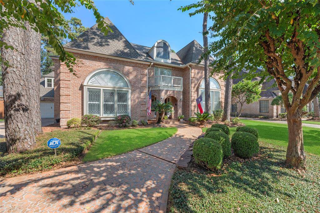 Welcome home to 15318 Wilkshire Court in the prestigious Woods of Wimbledon II community!