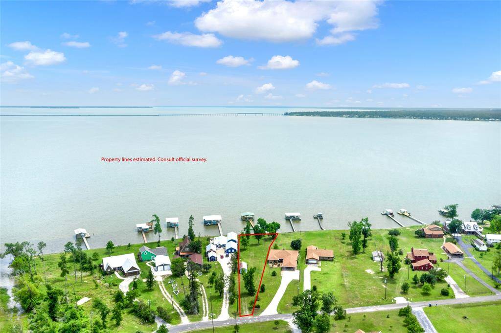 Pie shaped lot with a garage and storage unit with ample space to build a home. Enjoy the boathouse, fish or swim off the pier all while you build your dream home here.