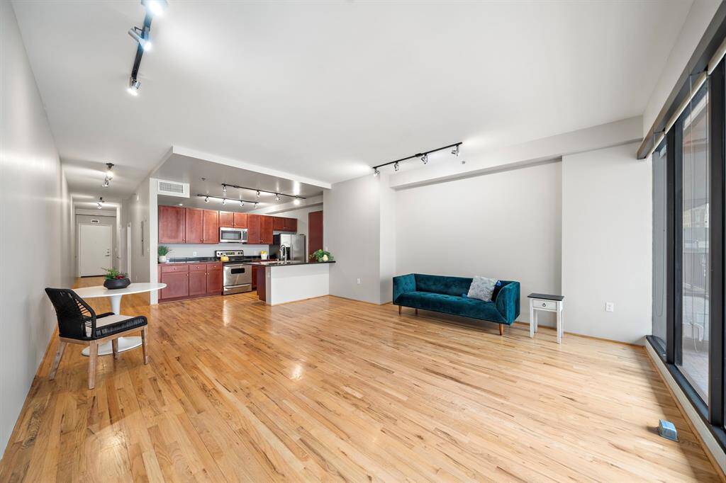 The hallway on the left side leads to the entrance door.