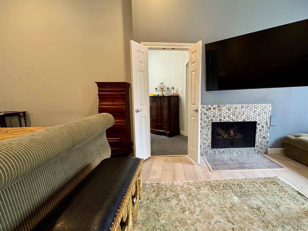 Master bedroom with lots of natural light and fireplace