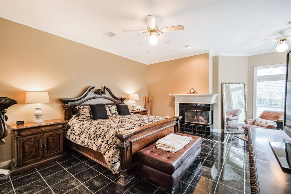 INDULGE IN THE SPA-LIKE AMBIANCE OF THIS PRIMARY BATHROOM, COMPLETE WITH AN EXPANSIVE 2-TIER VANITY AREA, DUAL SINKS, AND A WALK-IN-SHOWER TO COMPLETE THE SPA-LIKE EXPERIENCE.