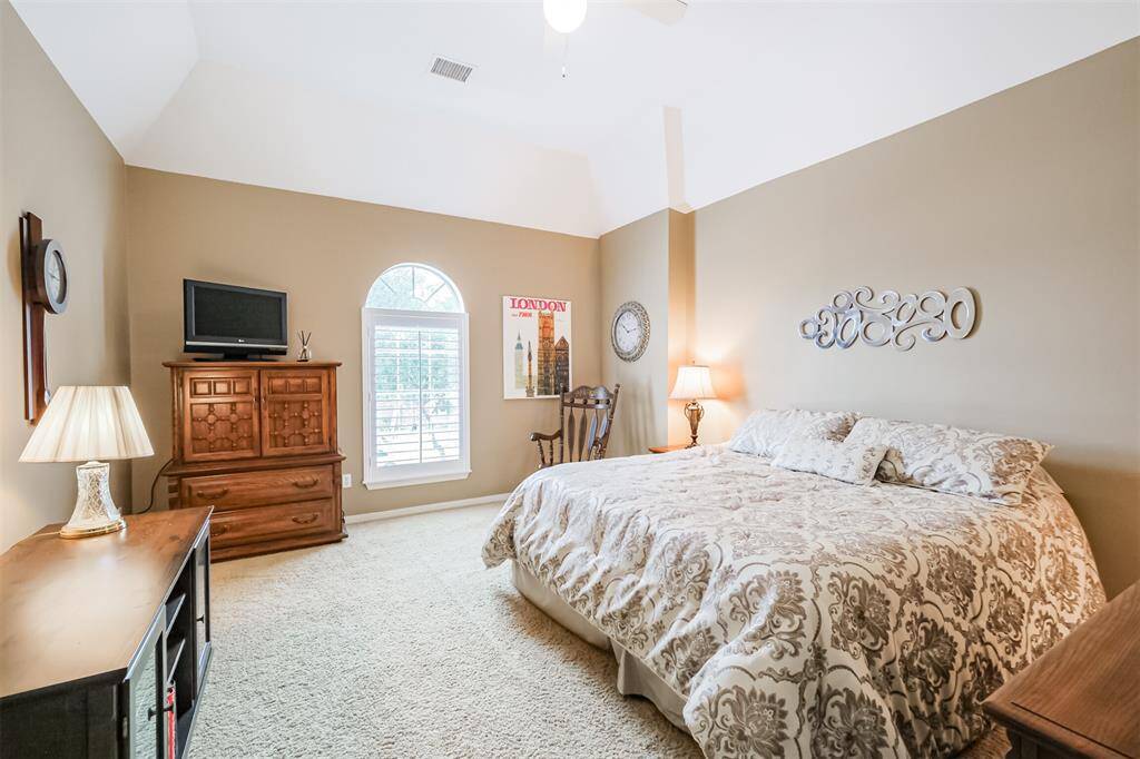 THE SECONDARY BEDROOM IS COMPLETE WITH A SPACIOUS LAYOUT AND DIRECT ACCESS TO THE JACK & JILL BATHROOM.