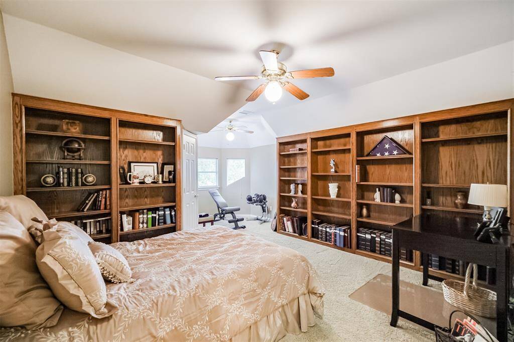 ANOTHER VIEW OF THIS SECONDARY BEDROOM, HIGHLIGHTING ITS GENEROUS SPACE AND CHARMING NOOK THAT OFFERS EXTRA FUNCTIONALITY.