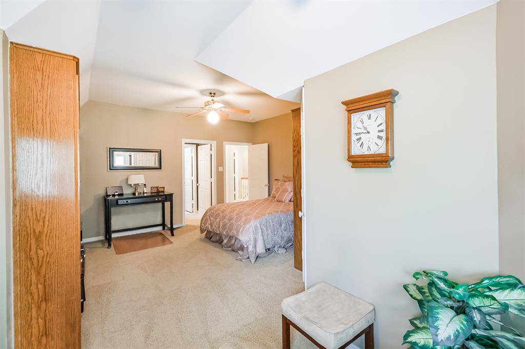 YOUR HOME FEATURES A COZY OUTDOOR SEATING AREA AND A STUNNING VIEW OF THE YARD OVER LOOKING THE GOLF COURSE.