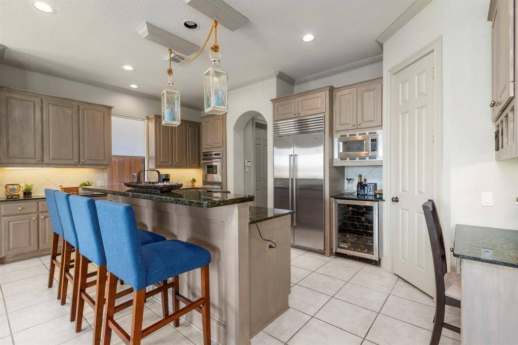 The Gorgeous Island Kitchen offers plenty of Cabinetry for the Chef.