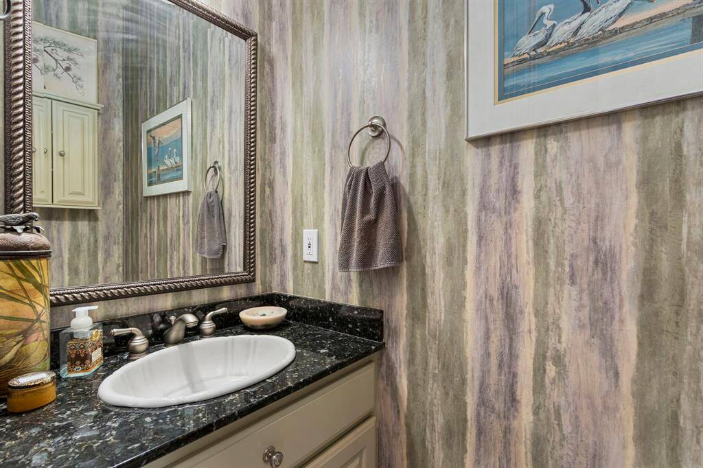 The Powder Room is located near the Outdoor Living Area.