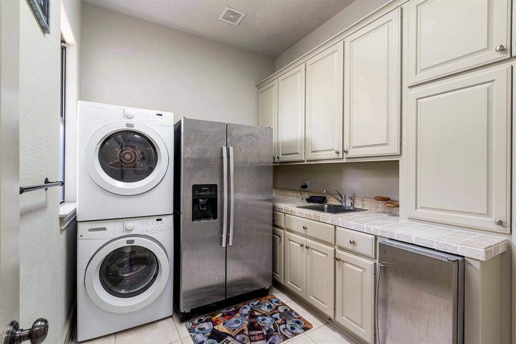 The Oversized Laundry Room offers plenty of Storage and a Mop Sink.