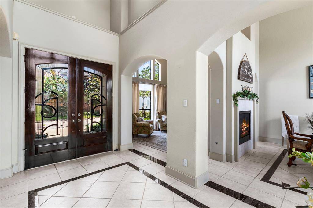 The Entry area opens to the Formal Living Room and Dining Room.
