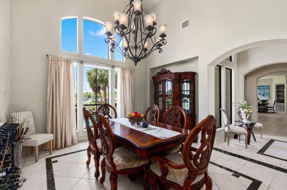 The Formal Dining Area Overlooks the Pool and Gorgeous Marina Waterviews.