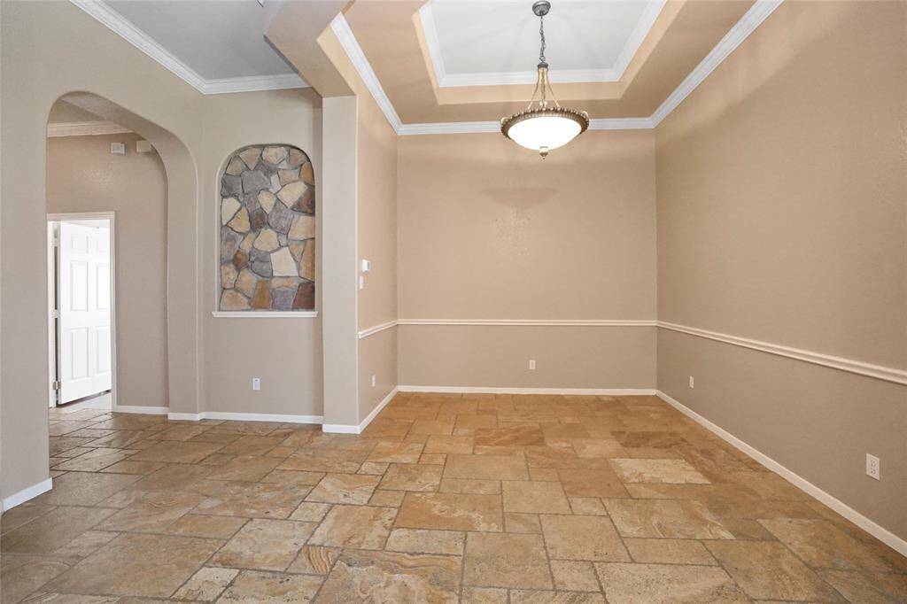 Bright and inviting dining room, perfect for family meals or entertaining guests.
