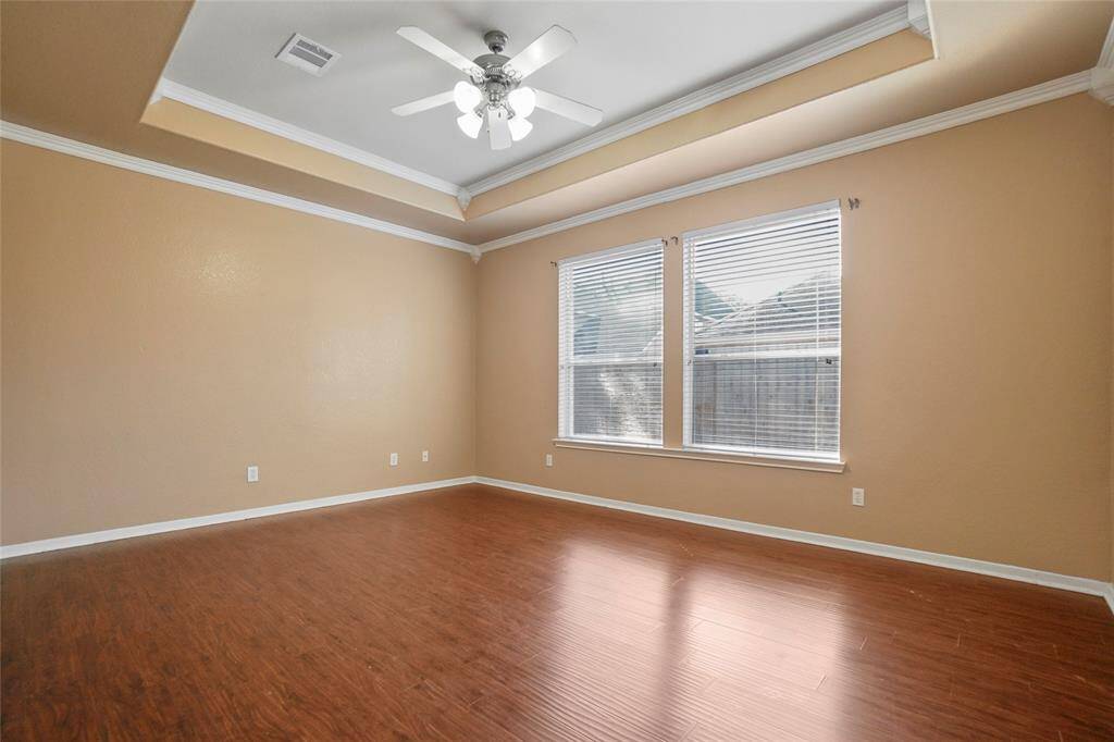 Spacious and serene, the primary bedroom offers a peaceful retreat with plenty of room to relax and unwind.