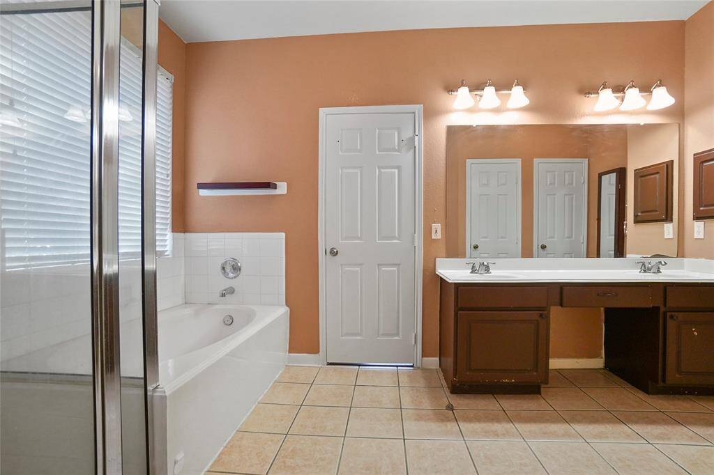 Primary bath with a separate shower and tub – perfect for relaxing after a long day.
