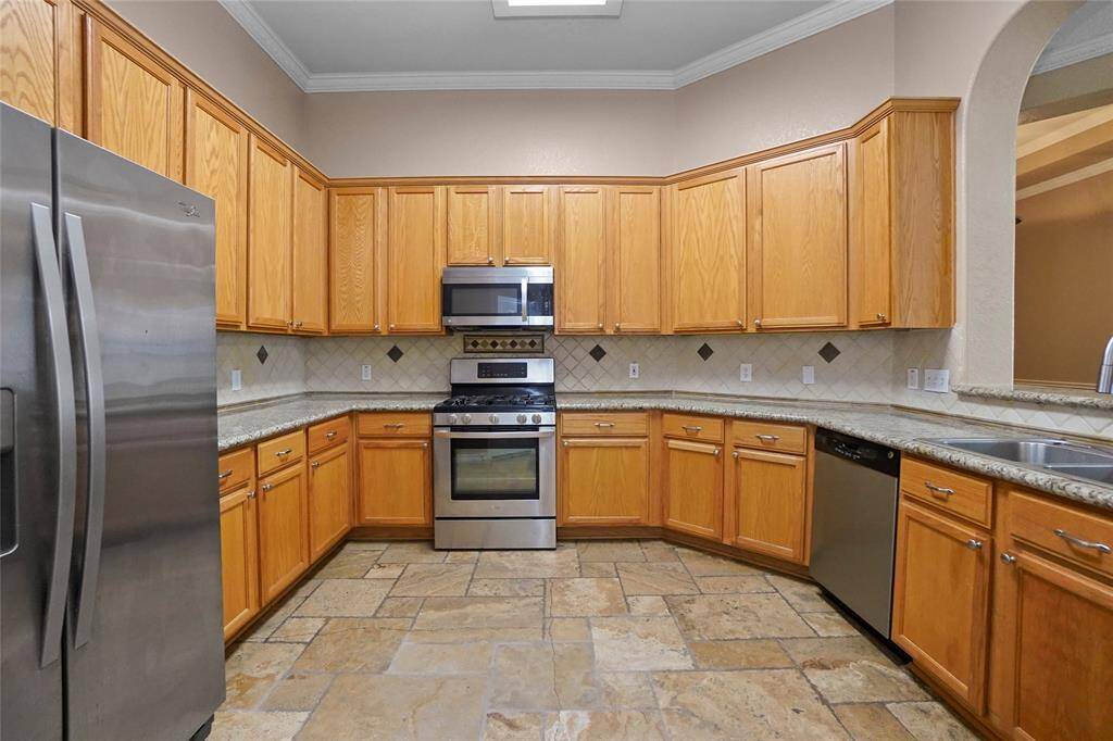 Open-concept kitchen with a view of the living room, creating the perfect space for gathering.