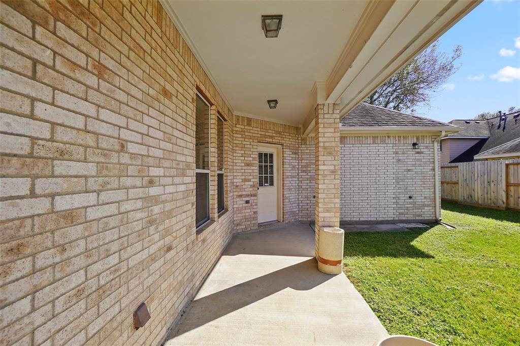 Relax or entertain under the covered patio, perfect for outdoor living year-round.