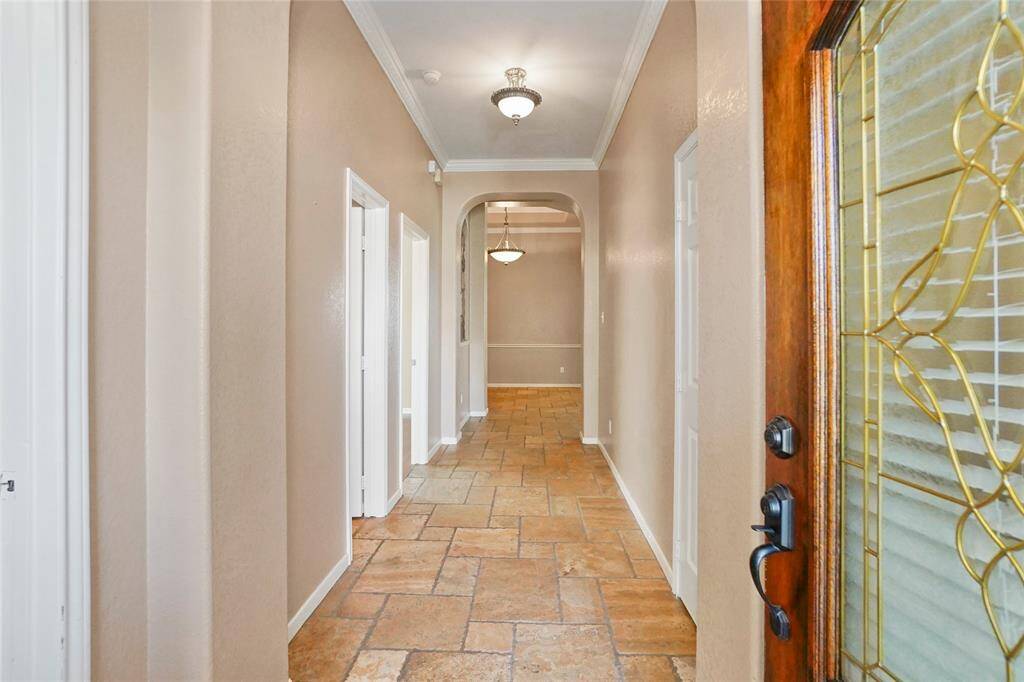Step inside and explore the welcoming hallway leading into your new home.