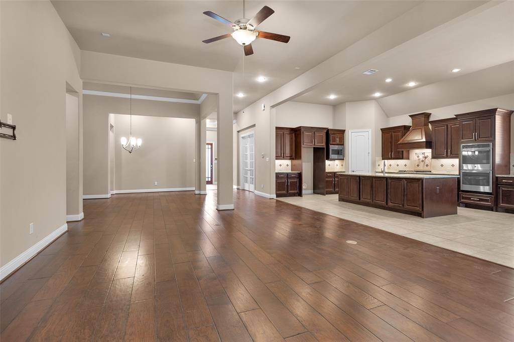 High ceilings and neutral tones create a bright and airy atmosphere.