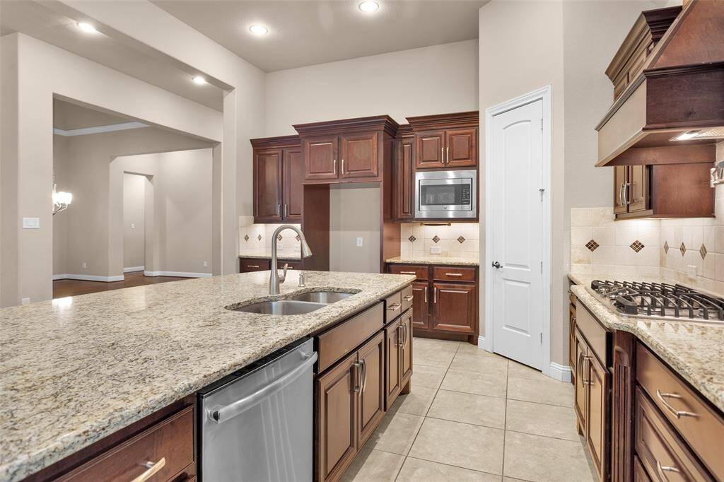 The open layout flows seamlessly into the adjacent living area, providing a spacious and inviting atmosphere.
