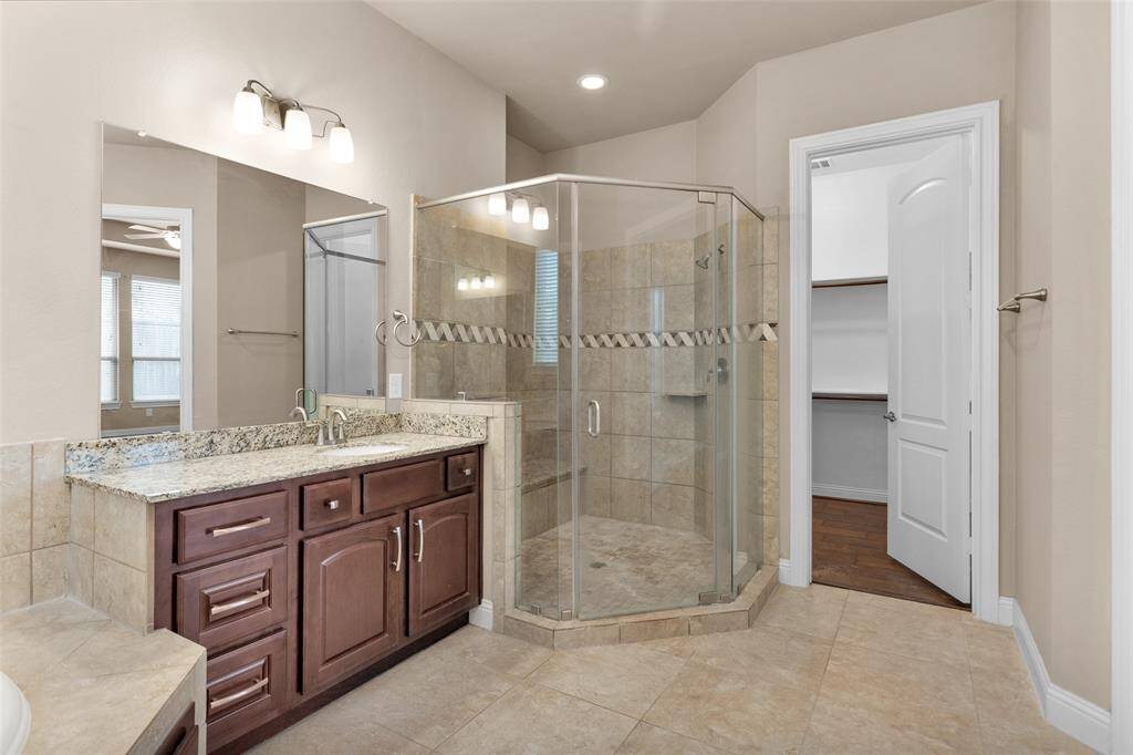 Look at that huge shower! Right next to the entrance of a huge walk in closet!