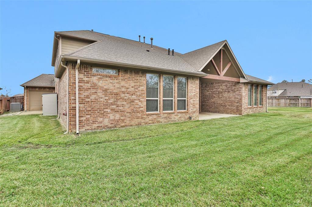 Well-kept lawn, offering privacy and outdoor relaxation space.