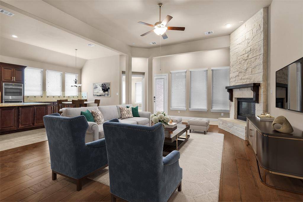 Virtual staging highlights this inviting family room with a cozy fireplace, perfect for gathering and relaxation.