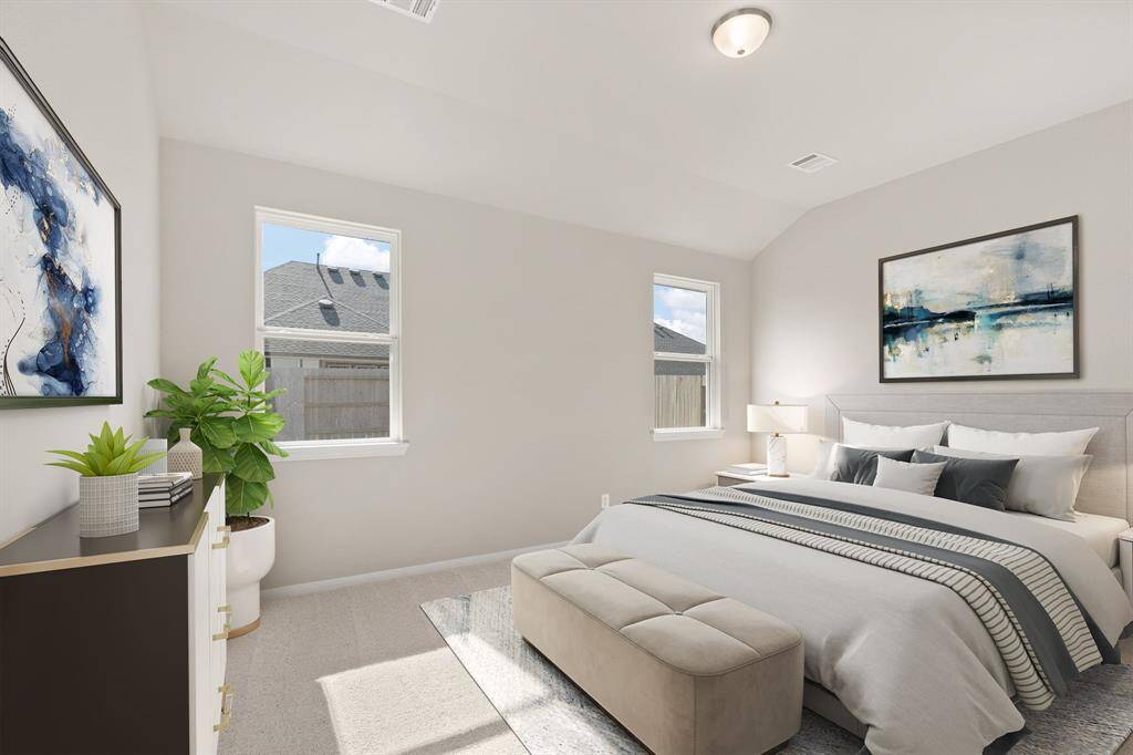 The primary bedroom is generously sized, creating a tranquil and spacious retreat that offers ample room for relaxation. Featuring plush carpet, high ceilings, fresh paint, and large windows that lets in natural lighting throughout the day.
