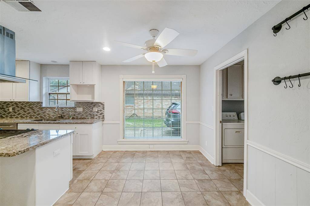 A view from the family room looking into the breakfast nook!  Tons of natural light and a ceiling fan!