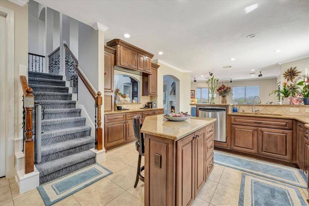 Kitchen offers 2nd staircase to upstairs.  Plenty of cabinets and counters in this great kitchen.