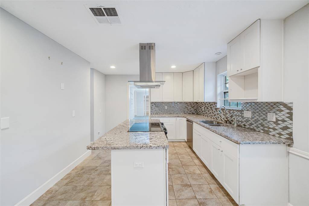 A chef's dream!  Beautiful granite counters with a modern diamond design backsplash!  Tons of counterspace for all your serving needs!