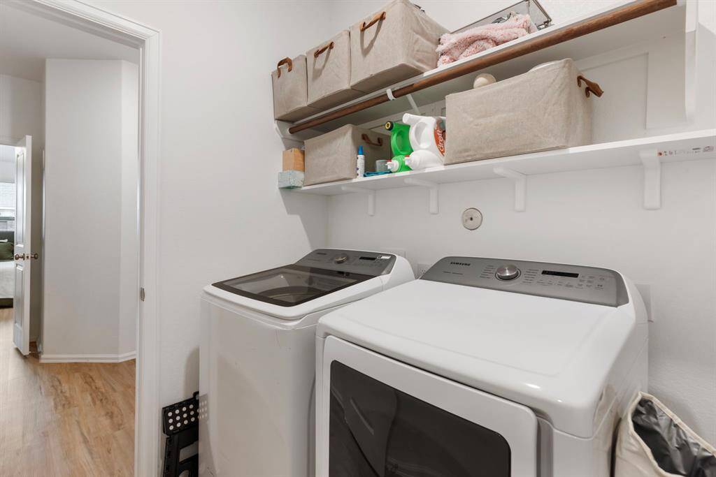 Laundry room located in the house connecting to the secondary primary closest.