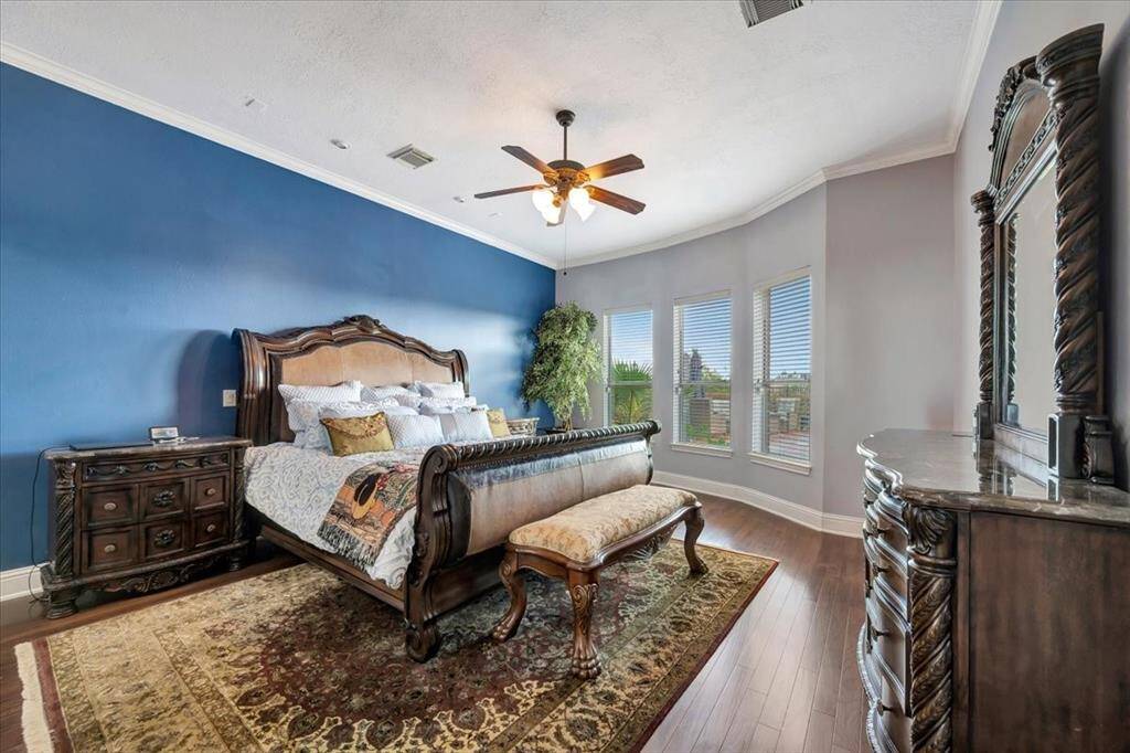 Private ensuite primary bedroom with view of all the backyard has to offer