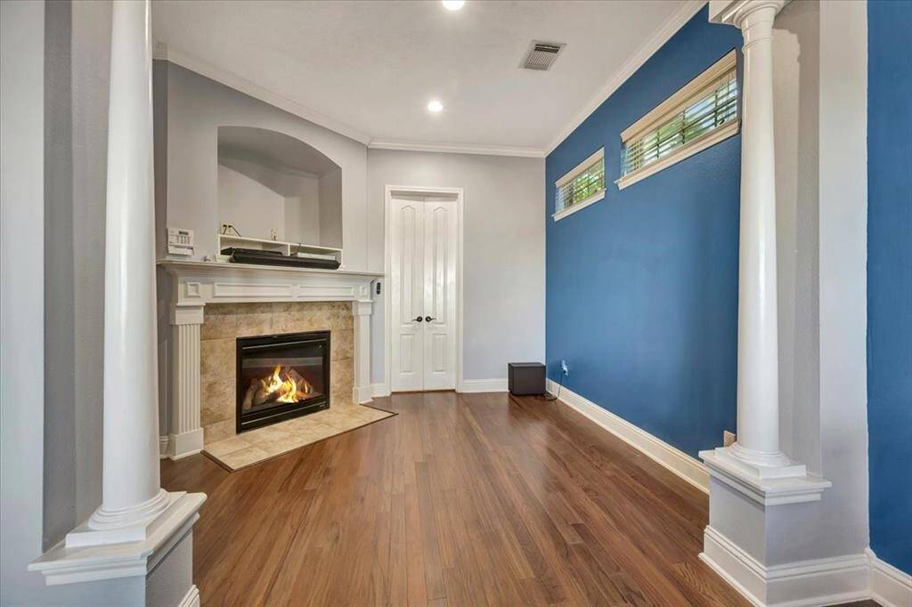 Cozy sitting area in primary bedroom just of bathroom.