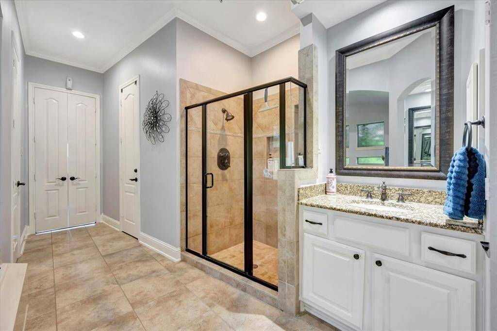 Oversized shower with double vanities.