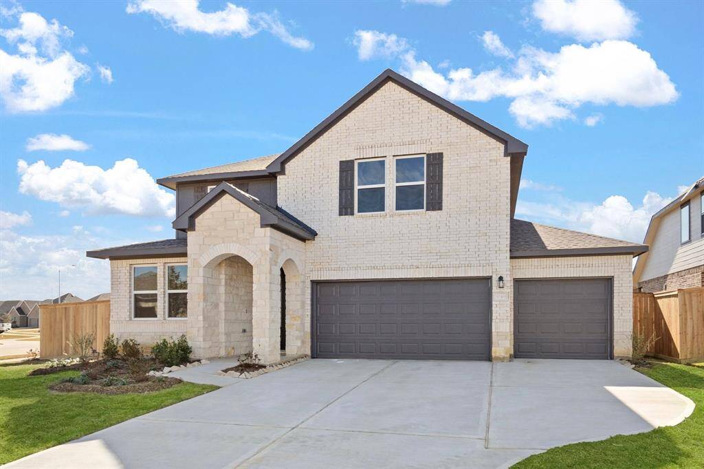 Welcome home to 32303 Tallow Creek Drive located in the Oakwood Estates community zoned to Waller ISD.