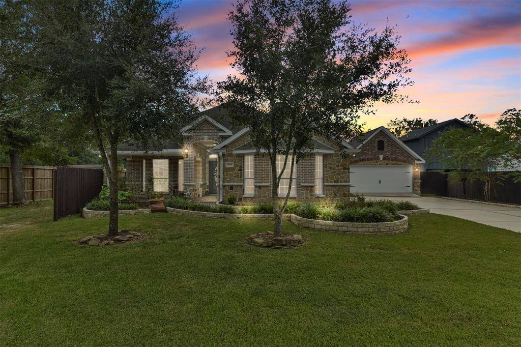 Stunning single-story home featuring a captivating brick and stone elevation located on a 0.413 acre lot
