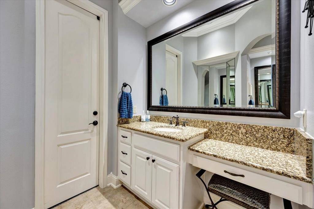 Vanity with sitting area.