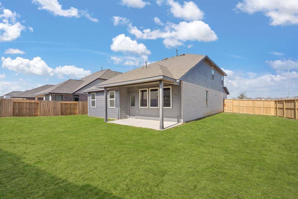 This backyard is perfect for family gatherings, social events, or simply unwinding in the fresh air.